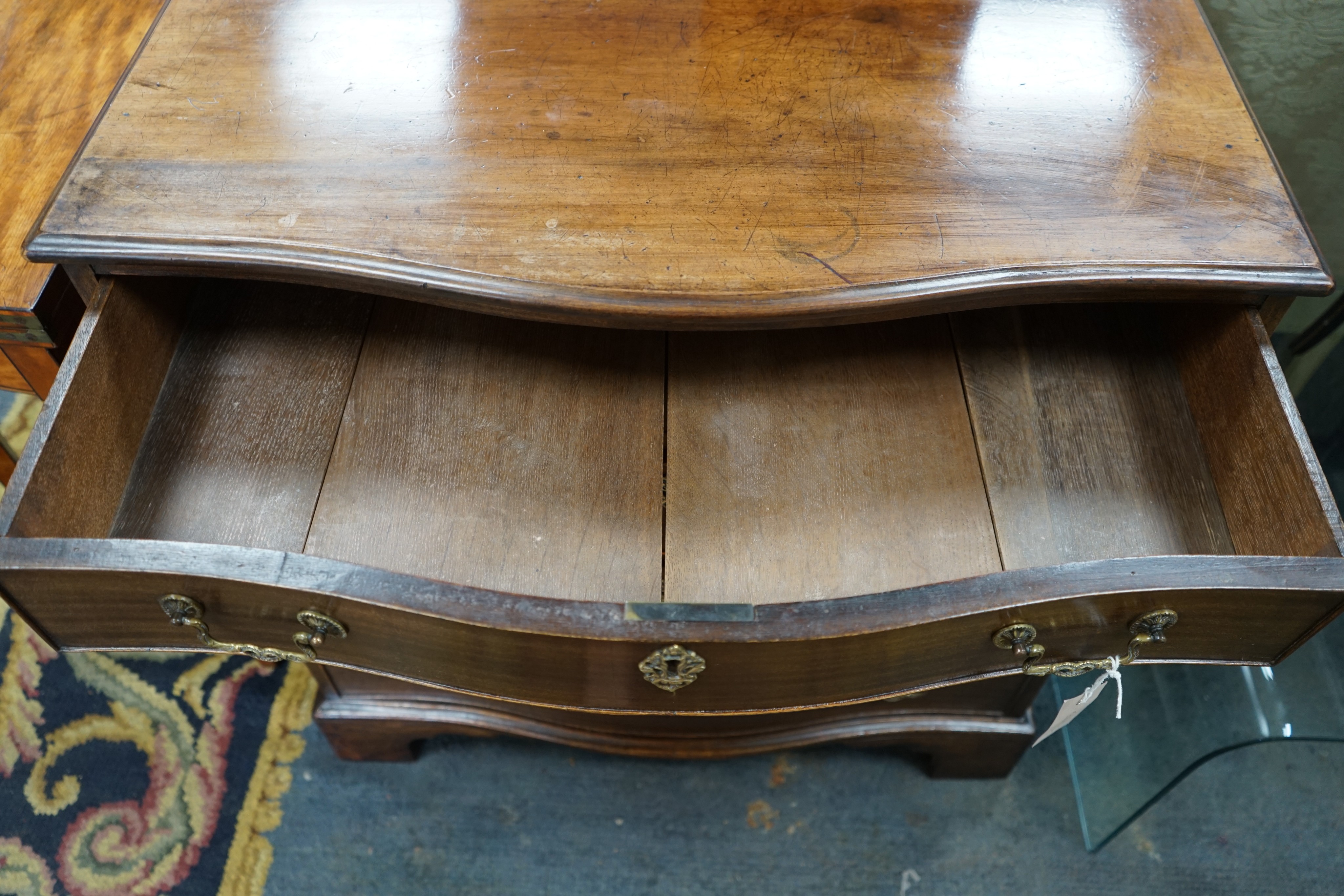 A George III mahogany four drawer serpentine chest, width 84cm, depth 49cm, height 86cm